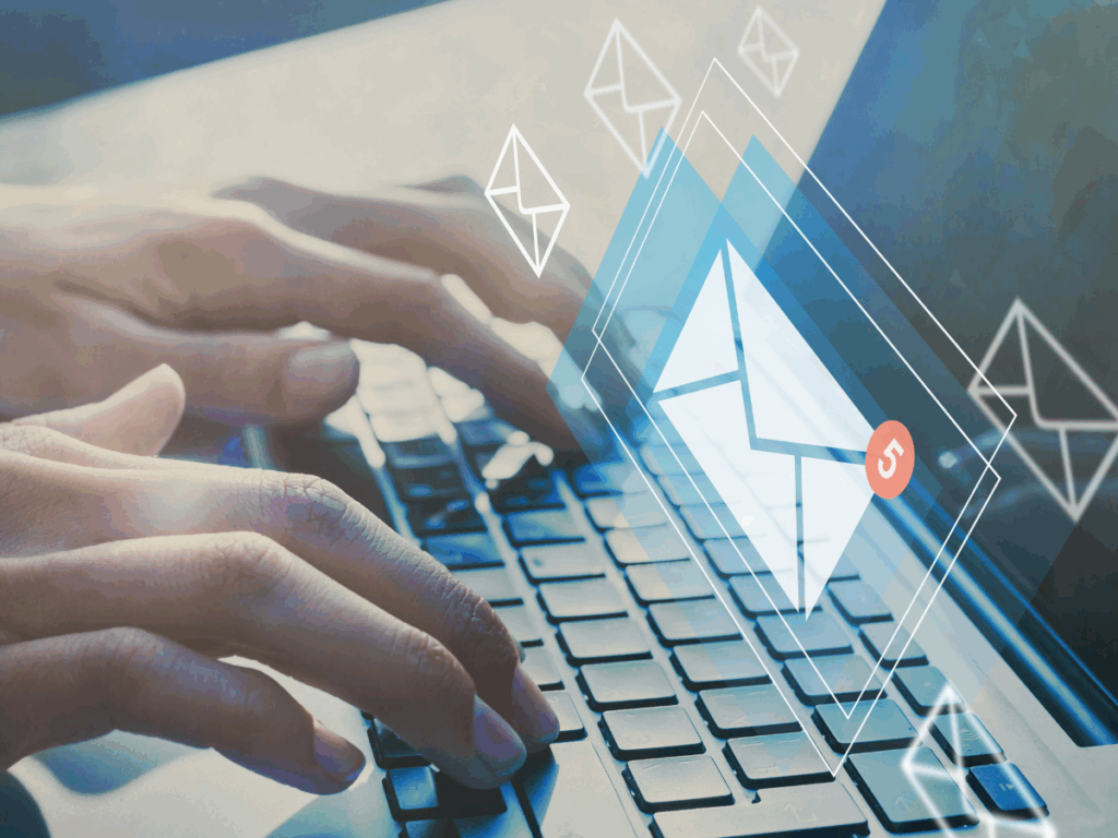 Hands typing on a keyboard. There is a notification of unread emails.