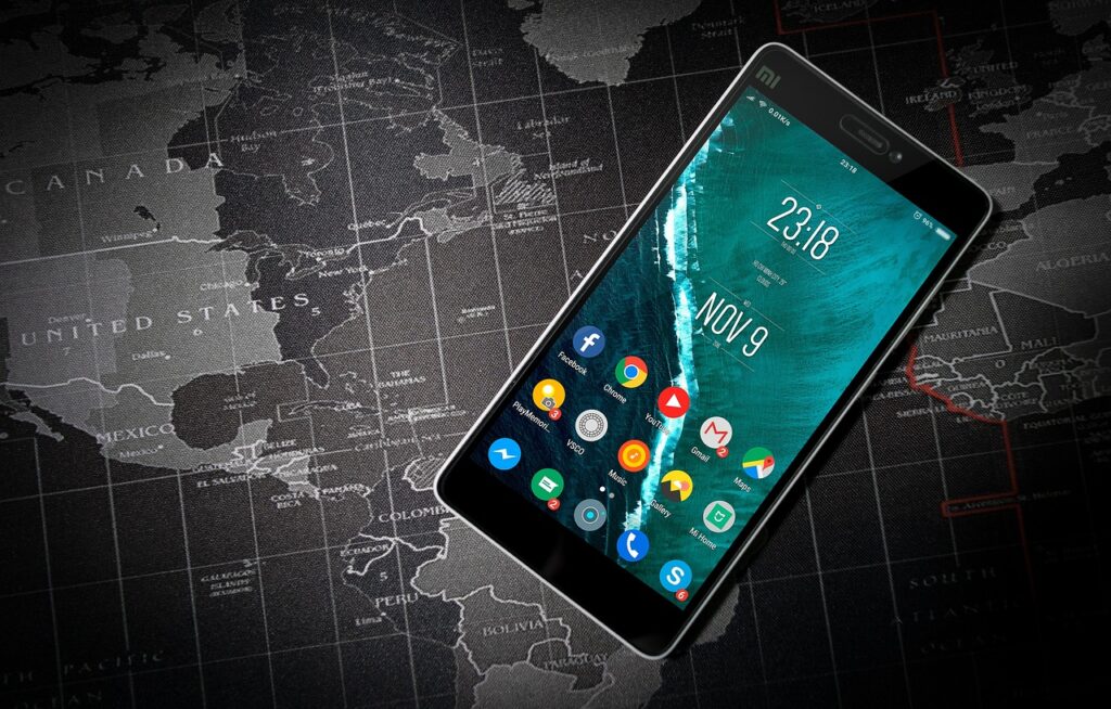 Person securing smartphone before international border crossing.