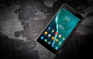 Person securing smartphone before international border crossing.
